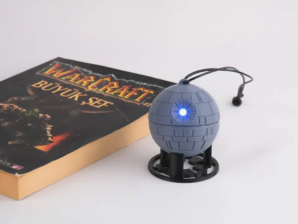3D printed Death Star ornament with LED lights, perfect for Star Wars fans and holiday decorations
