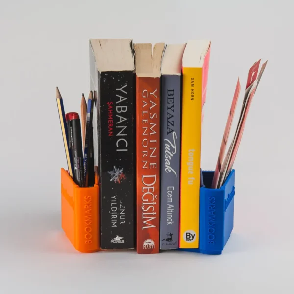 A book-shaped bookend that doubles as a storage organizer for bookmarks, pens, and small desk accessories, perfect for book lovers and office decor.