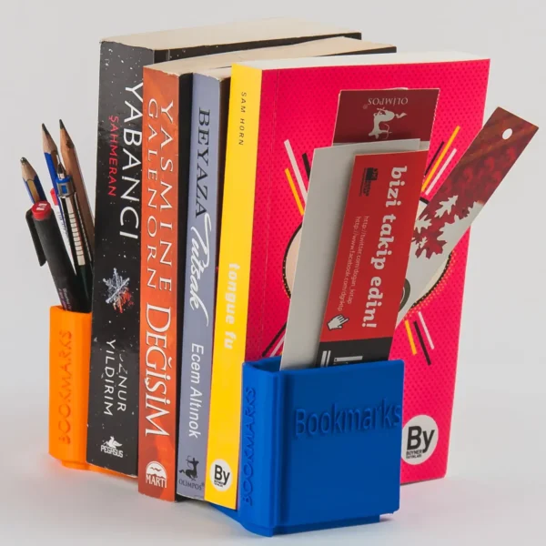 A book-shaped bookend that doubles as a storage organizer for bookmarks, pens, and small desk accessories, perfect for book lovers and office decor.