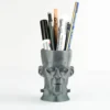 A Frankenstein-themed planter and pen holder, perfect for adding a unique and functional touch to your Halloween decor.