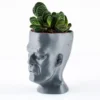 A Frankenstein-themed planter and pen holder, perfect for adding a unique and functional touch to your Halloween decor.