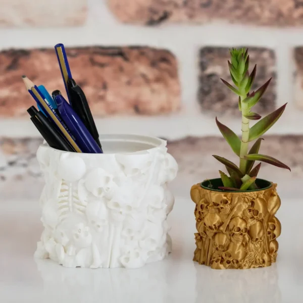 A gothic planter with human bones and a skull, perfect for plants and pens. A stylish and functional addition to your home or office decor.