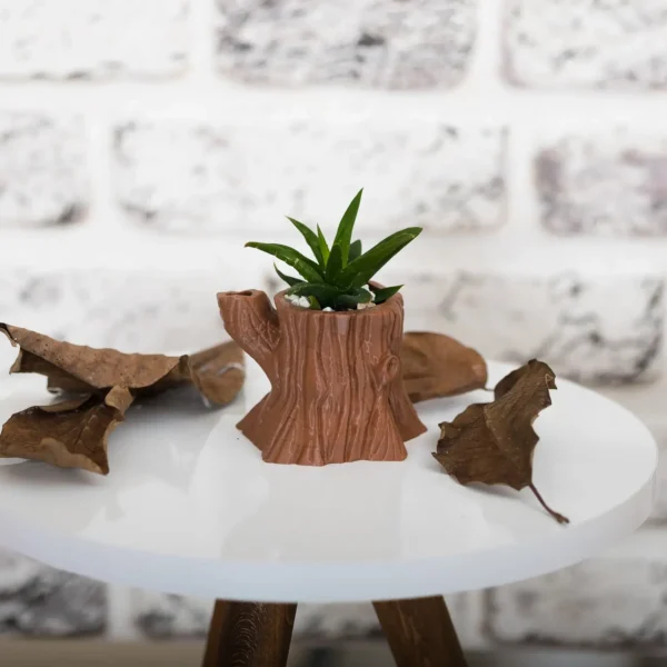 An old tree stump planter with a wood-like design, perfect for air plants, garden decoration, and makeup brushes. A stylish and functional addition to your home or garden decor.