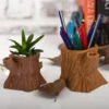 An old tree stump planter with a wood-like design, perfect for air plants, garden decoration, and makeup brushes. A stylish and functional addition to your home or garden decor.