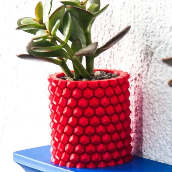 A pineapple-patterned cylinder planter, perfect for holding plants, pens, brushes, and more. A stylish and functional addition to your home or office decor.