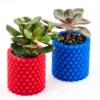 A pineapple-patterned cylinder planter, perfect for holding plants, pens, brushes, and more. A stylish and functional addition to your home or office decor.