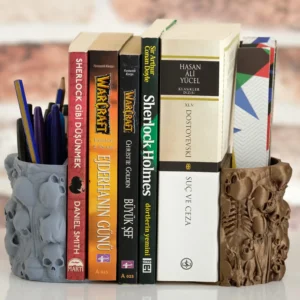 A gothic bookend with human bones and a skull, perfect for organizing books, pens, and bookmarks. A stylish and functional addition to your bookshelf.