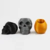 A human skull-shaped planter and pen holder, perfect for adding a unique and functional touch to your home or office decor.