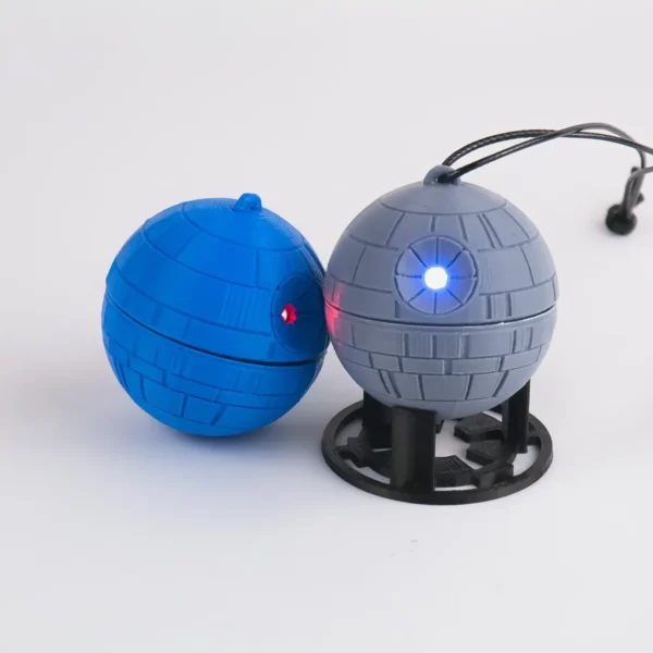 A Star Wars Death Star ornament with a twist mechanism that activates an LED light. Perfect for adding a galactic touch to your Christmas tree.