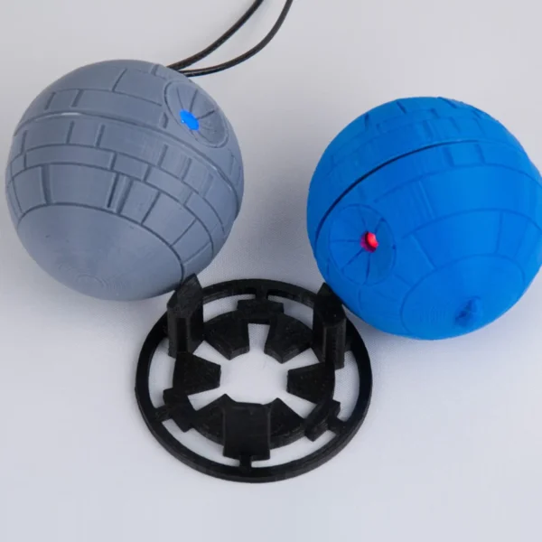 A Star Wars Death Star ornament with a twist mechanism that activates an LED light. Perfect for adding a galactic touch to your Christmas tree.