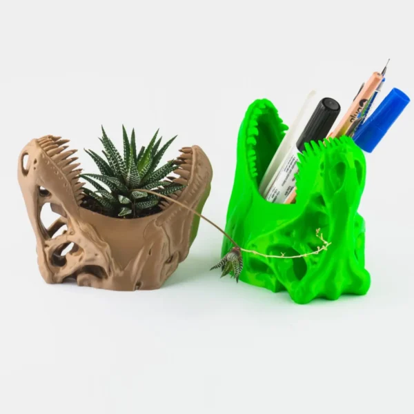 A T-Rex skull succulent planter and pen holder, perfect for adding a unique and functional touch to your home or office decor.