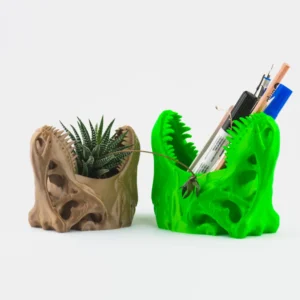 A T-Rex skull succulent planter and pen holder, perfect for adding a unique and functional touch to your home or office decor.