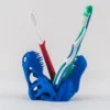 A desktop T-Rex skull toothbrush holder, perfect for adding a unique and functional touch to your bathroom decor.