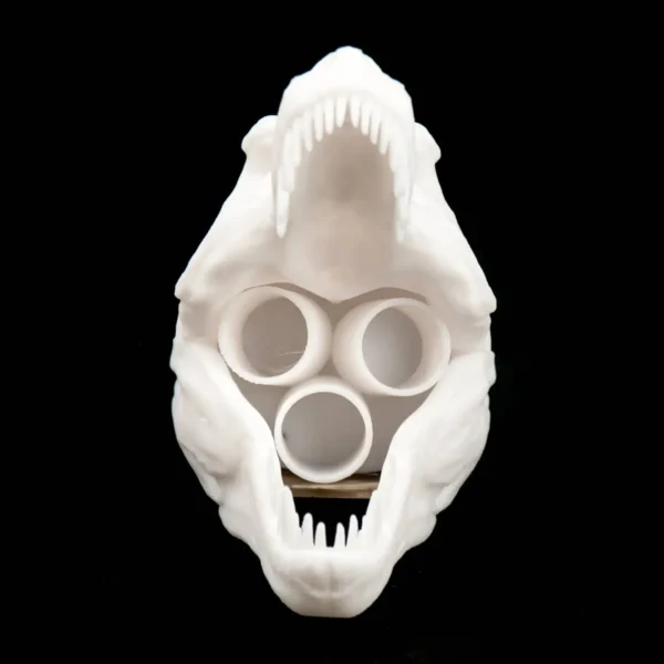 A desktop T-Rex skull toothbrush holder, perfect for adding a unique and functional touch to your bathroom decor.