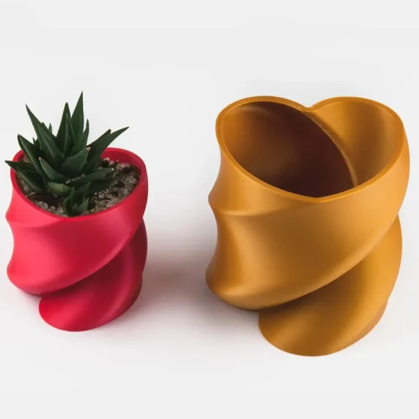 A twisted heart-shaped planter that doubles as a pen or brush holder, perfect for Valentine's Day gifts and modern home decor.