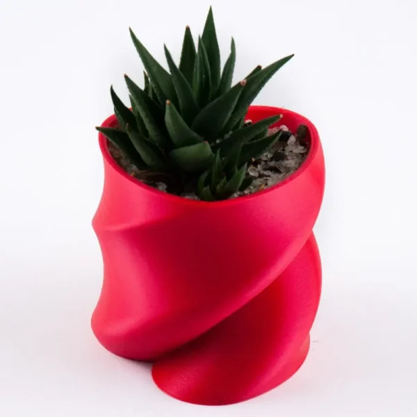 A twisted heart-shaped planter that doubles as a pen or brush holder, perfect for Valentine's Day gifts and modern home decor.